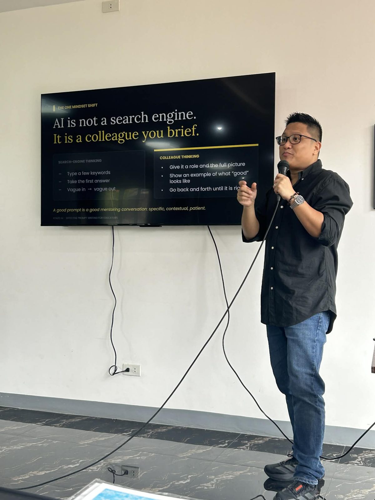 Kenzo AI slide — AI is not a search engine, it is a colleague you brief