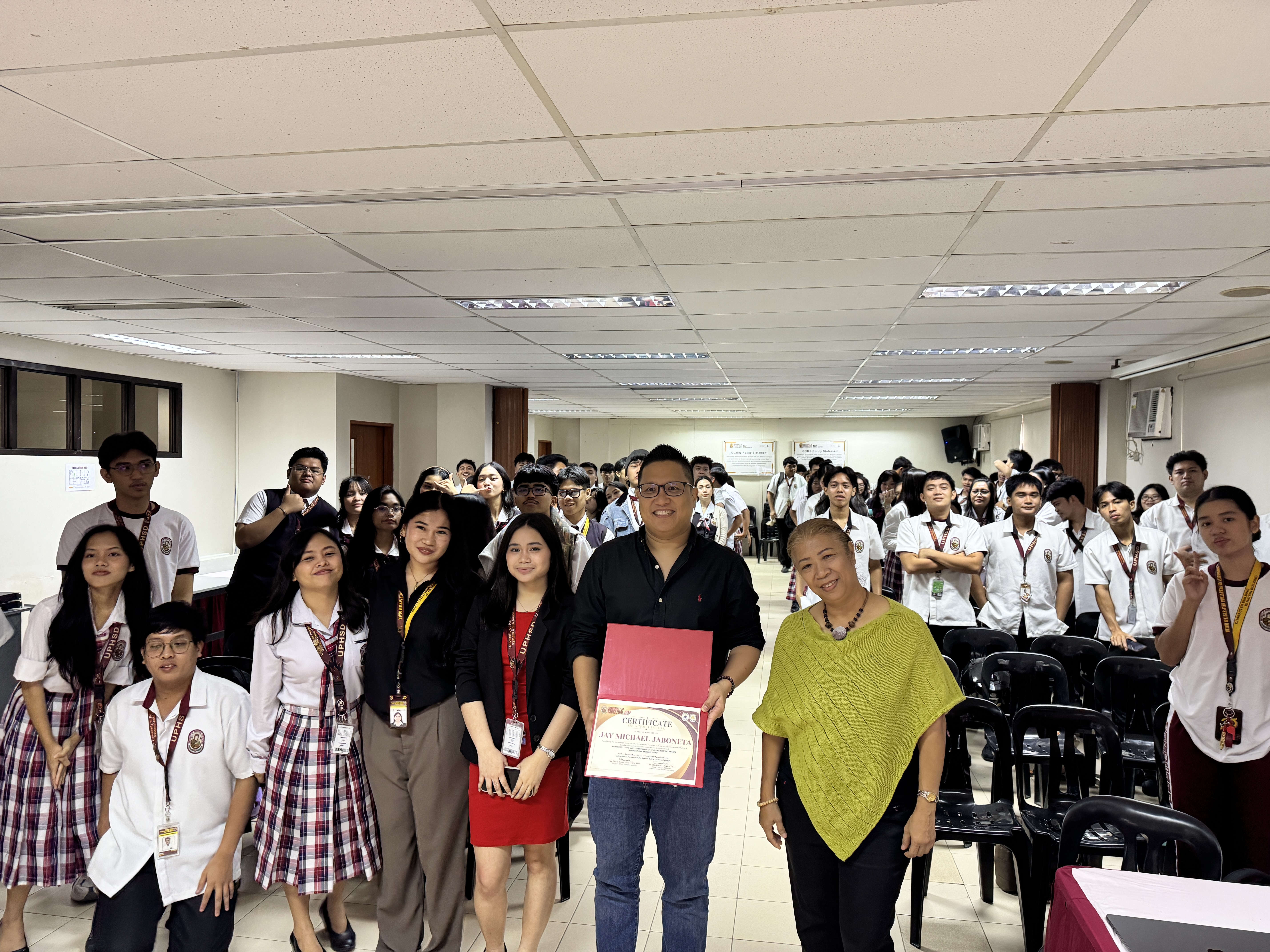 Jay Jaboneta and students of UPHSD Molino with the Entrepreneurship Program Chair after the AI video production workshop