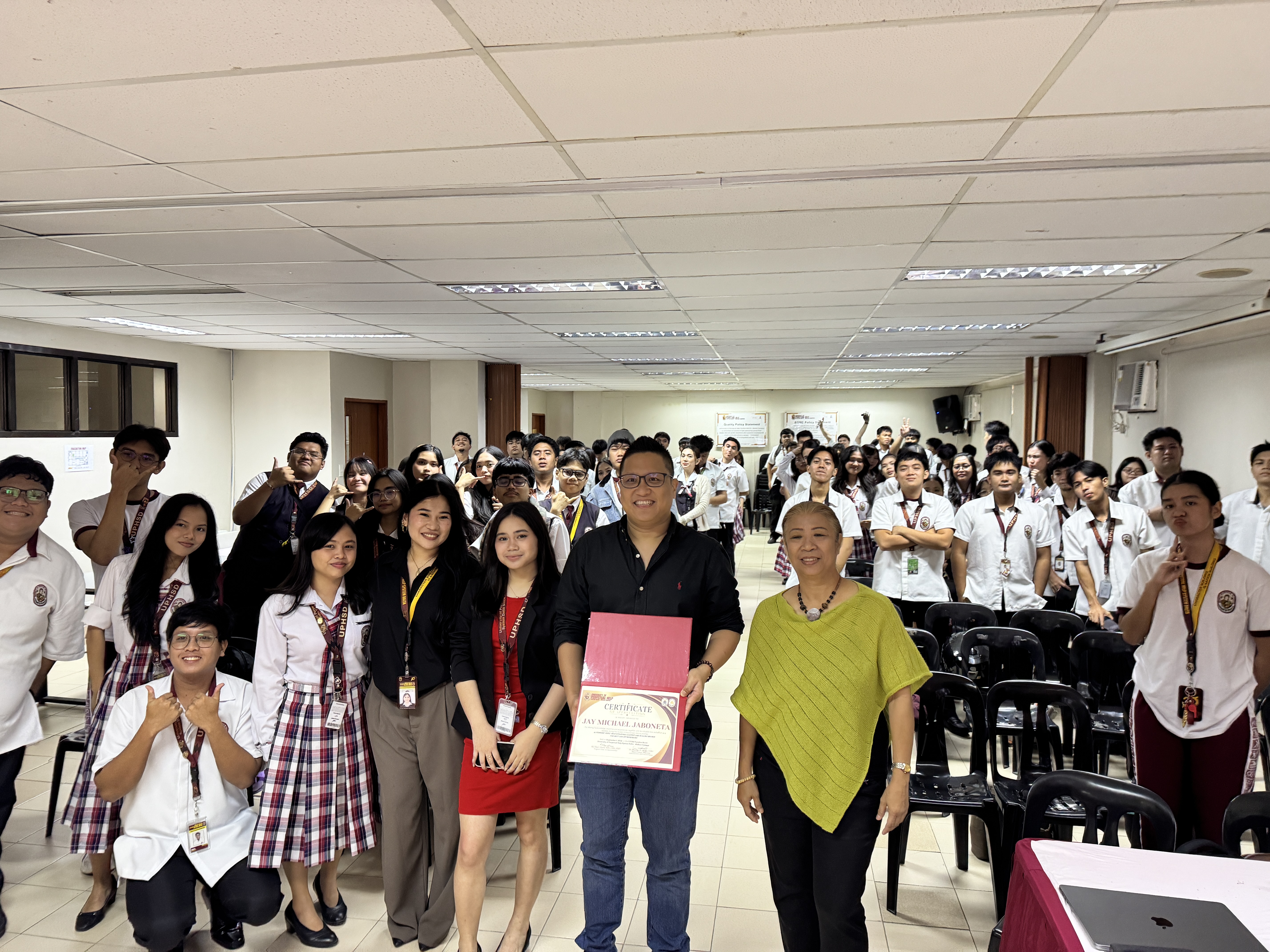 Jay Jaboneta with students and faculty of University of Perpetual Help System DALTA Molino campus after the AI video production workshop